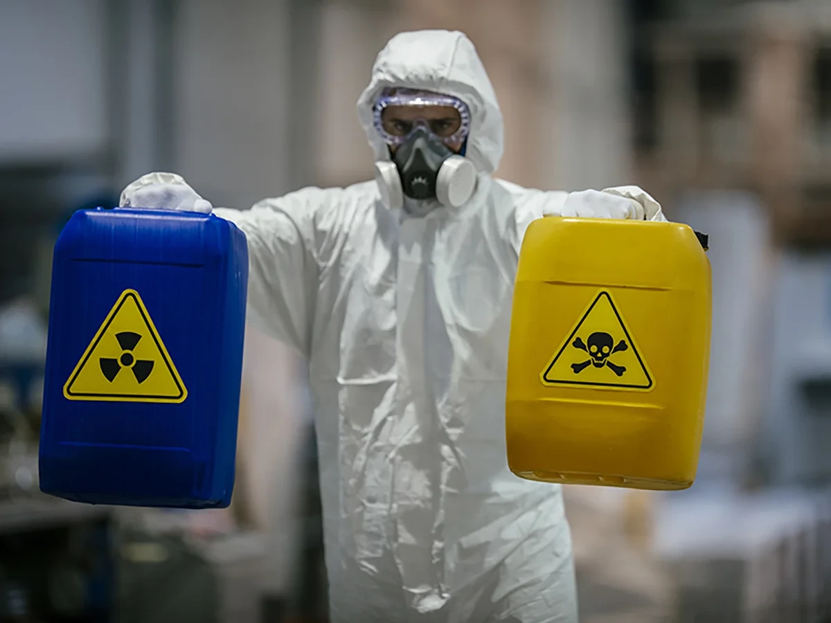 Biohazard cleanup technicians in protective equipment at a remediation scene in O Fallon, MO